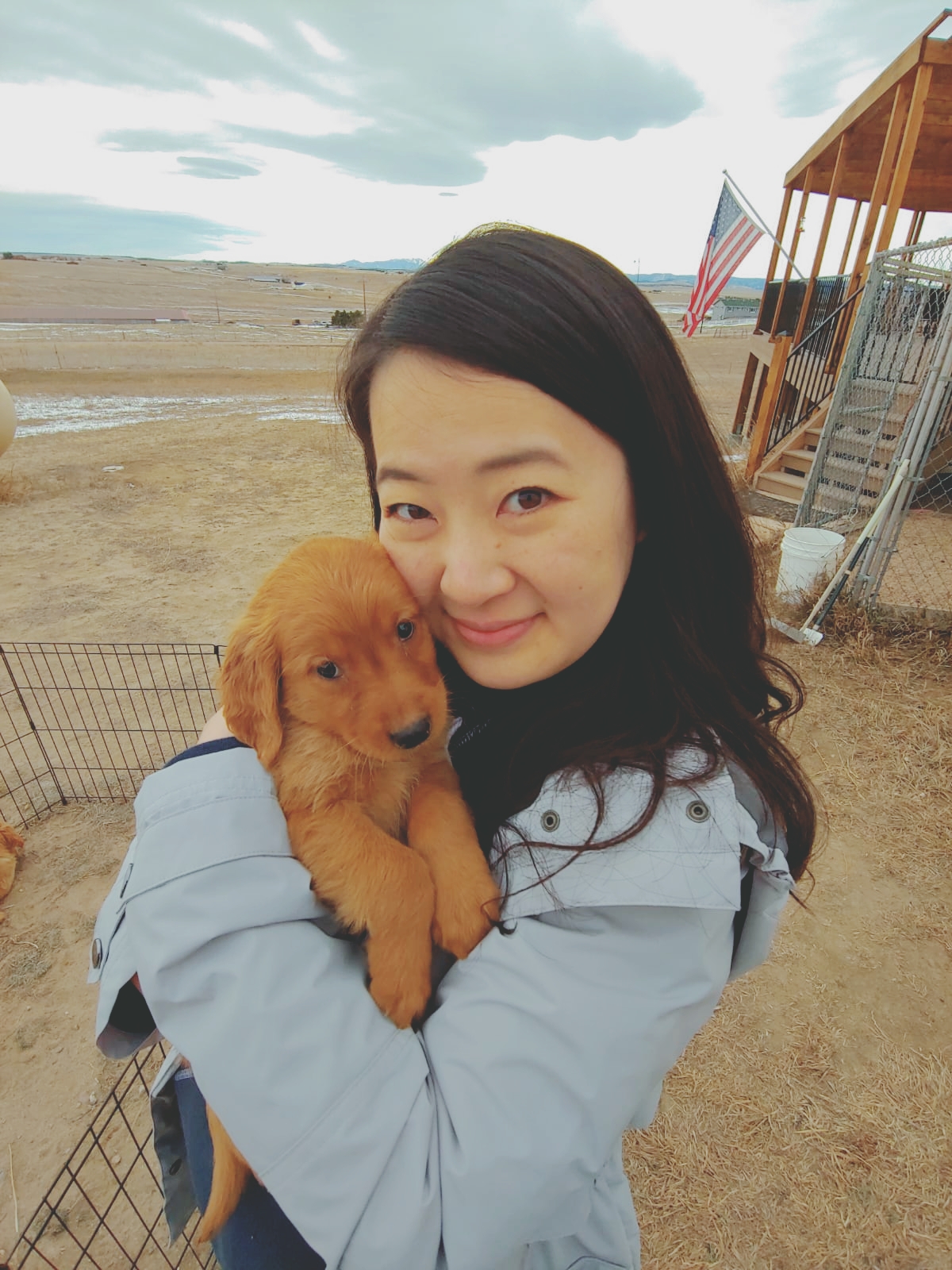 Female holding a puppy